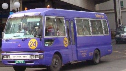 A purple local route bus at a bus terminal in Bandar Seri Begawan, Brunei